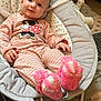 baby, baby_rocker, blanket, child, comfort, cozy, cute, face, home, indoor, infant, knitted, pajamas, pink_booties, relaxed, seated, smile, soft, striped_clothing, toy