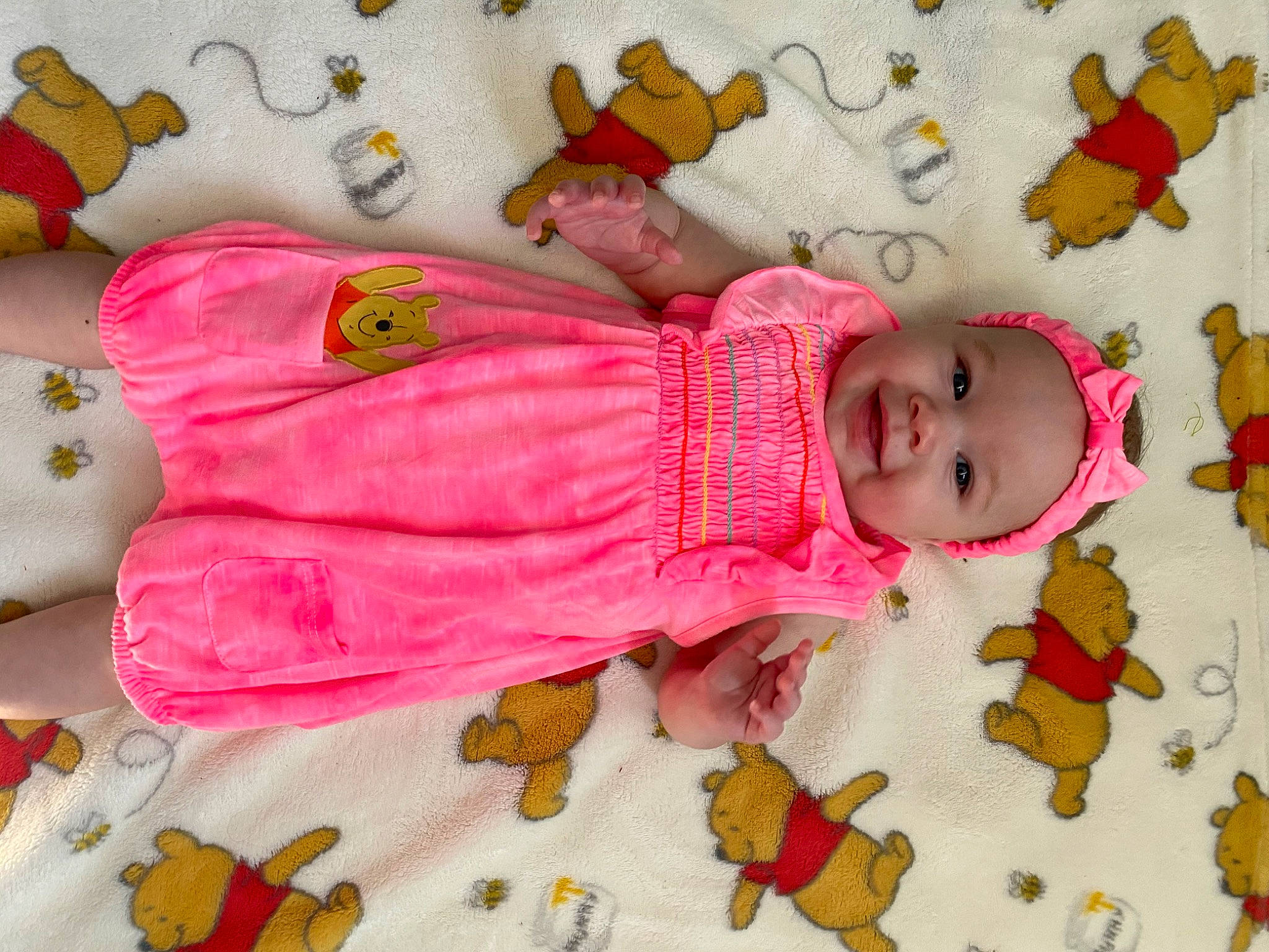 Alyla is registered to the contest to win money with this photo: baby, child, headwear, joy, nap_mat, person, pink, textile, toddler