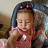 toddler, child, high_chair, hair_clips, comb, pink_clothing, indoor, table, food, baby, person, cute, seat, jewelry, expression, hand, face, hair, eating, home