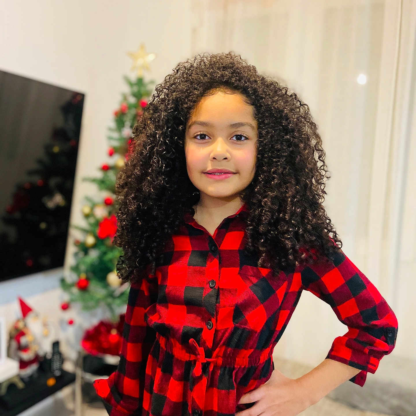 Emilly Sophia participe au concours pour gagner de l'argent avec cette photo : blackhair, christmas, christmasdecorations, christmastree, clothing, coat, curlyhair, dimples, face, female, festival, girl, hair, head, person, sleeve, teen