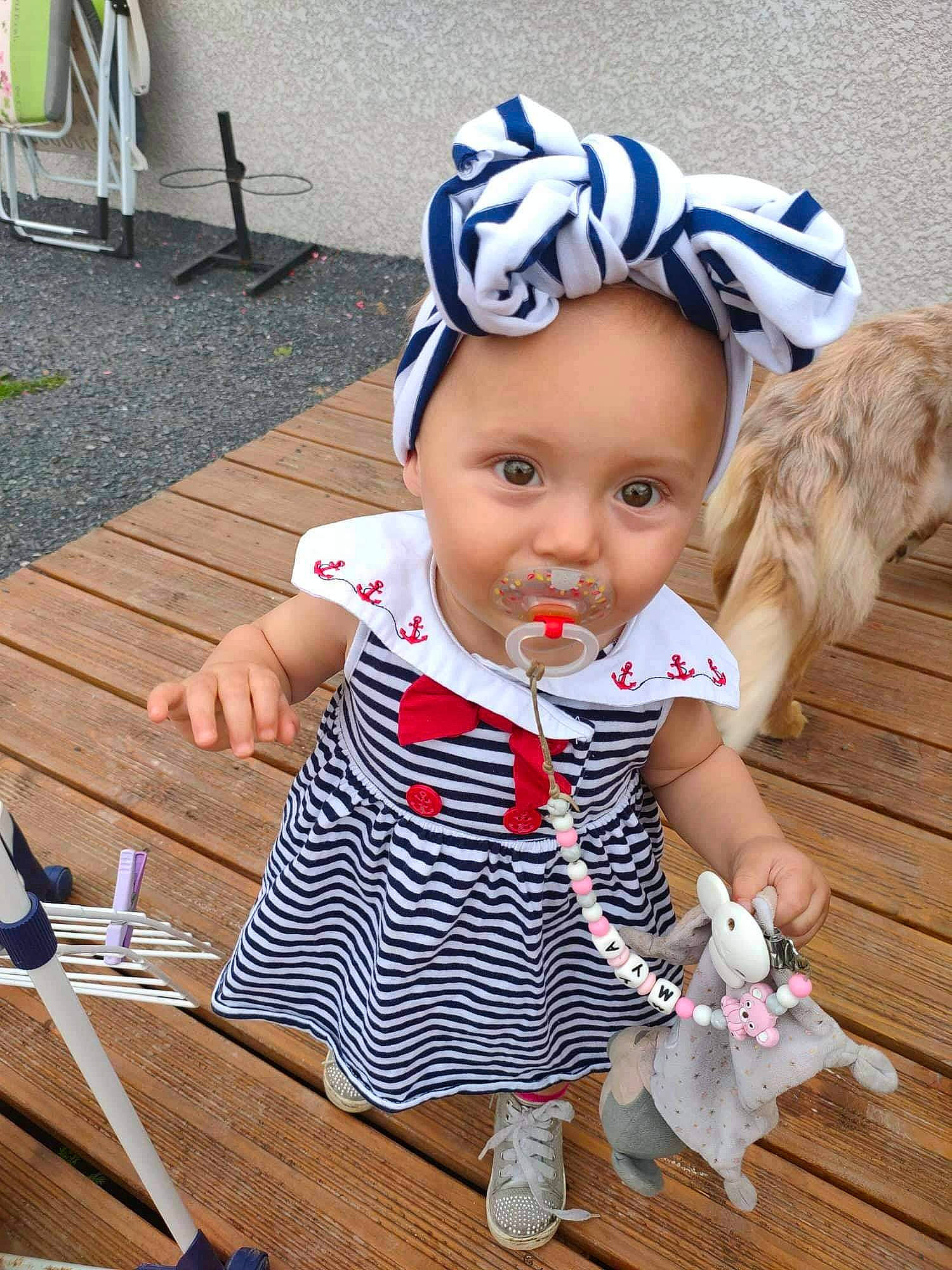 Mya participe au concours pour gagner de l'argent avec cette photo : baby, baby_toddler_clothing, cap, child, costume, costume_hat, doll, fashion_accessory, fun, happy, headband, headgear, headpiece, headwear, party_supply, pattern, person, sitting, sleeve, toddler