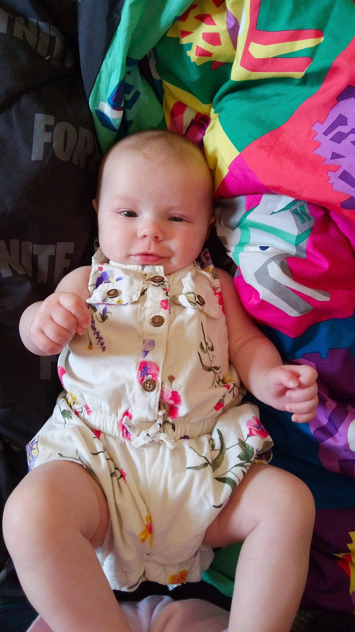 Izabella is registered to the contest to win money with this photo: baby, baby_products, baby_toddler_clothing, cheek, child, eye, happy, head, human_body, human_leg, lap, mouth, nail, person, pink, sitting, skin, smile, textile, thigh