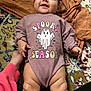 baby, babylaughing, bed, bedroom, clothing, cushion, face, furniture, happy, head, homedecor, newborn, person, photography, portrait, quilt, sitting, sleeve, smile, t_shirt