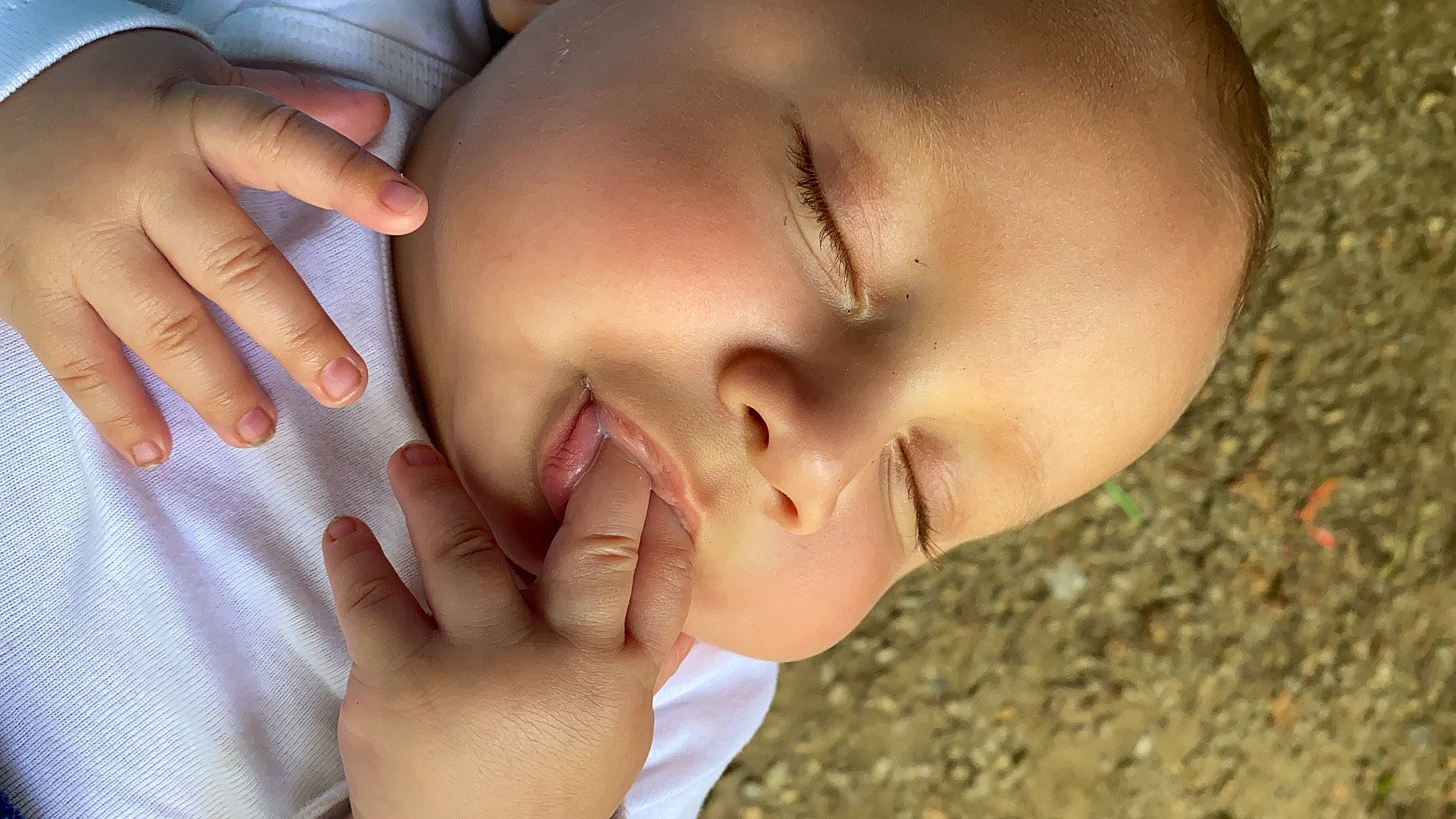 Legend is registered to the contest to win money with this photo: baby, cheek, child, chin, close_up, eye, eyebrow, eyelash, face, finger, forehead, hand, head, lip, mouth, muscle, nail, neck, nose, person