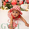 baby, child, crawling, hat, red_and_white, checkered_pattern, cute, indoors, photography, studio, smiling, face, eyes, mouth_open, background, strawberries, greenery, soft_lighting, infant, clothing