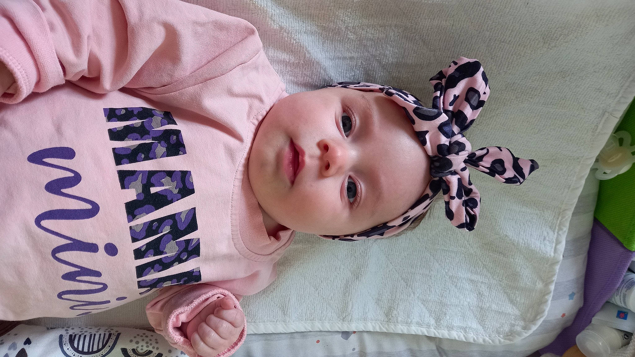 Romy participe au concours pour gagner de l'argent avec cette photo : baby, baby_toddler_clothing, cheek, comfort, eye, eyelash, face, facial_expression, headgear, headwear, linens, lip, mammal, nose, person, pink, product, purple, skin, sleeve