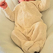 Qassim participe au concours pour gagner de l'argent avec cette photo : baby, newborn, infant, sleeping, onesie, soft, cushion, blanket, cozy, peaceful, cute, child, portrait, indoor, relaxed, small_hands, closed_eyes, face, head, person