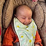 Eva a rejoint le concours — aidez-le/la à gagner de superbes lots ! baby, infant, car_seat, bib, orange_clothing, pacifier, sleeping, smiling, child, cute, soft_toys, fabric, comfort, resting, hand, closeup, indoors, childcare, seatbelt, head_support