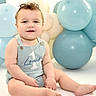 Louis joined the competition — help win amazing prizes! baby, balloons, birthday, blue, casual_clothing, celebration, child, curly_hair, cute, first_birthday, happy, infant, one_year_old, portrait, romper, sitting, smiling, soft_lighting, studio, white_background