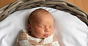 Caissian joined the competition — help win amazing prizes! baby, basket, blanket, brown_hair, closed_eyes, cozy, face, head, indoor, infant, newborn, nursery, peaceful, photography, portrait, sleeping, soft_lighting, swaddled, white_bedding, wooden_background