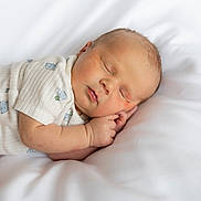 Caissian joined the competition — help win amazing prizes! newborn, baby, sleeping, infant, portrait, face, eyes_closed, bed, bedding, white, indoors, onesie, clothing, peaceful, resting, lying_down, soft, close_up, cute, photography