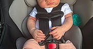 Caissian joined the competition — help win amazing prizes! baby, newborn, sleeping, infant, car_seat, vehicle, harness, seatbelt, pacifier, portrait, indoors, safe, buckled, white_shirt, pink_clothing, bare_feet, closed_eyes, peaceful, child, photograph