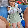 élyne participe au concours pour gagner de l'argent avec cette photo : toddler, child, smiling, happy, outdoor, adult, legs, denim_shorts, dress, mittens, leggings, barefoot, flower, greenery, floor_tiles, tattoo, necklace, person, summer, garden