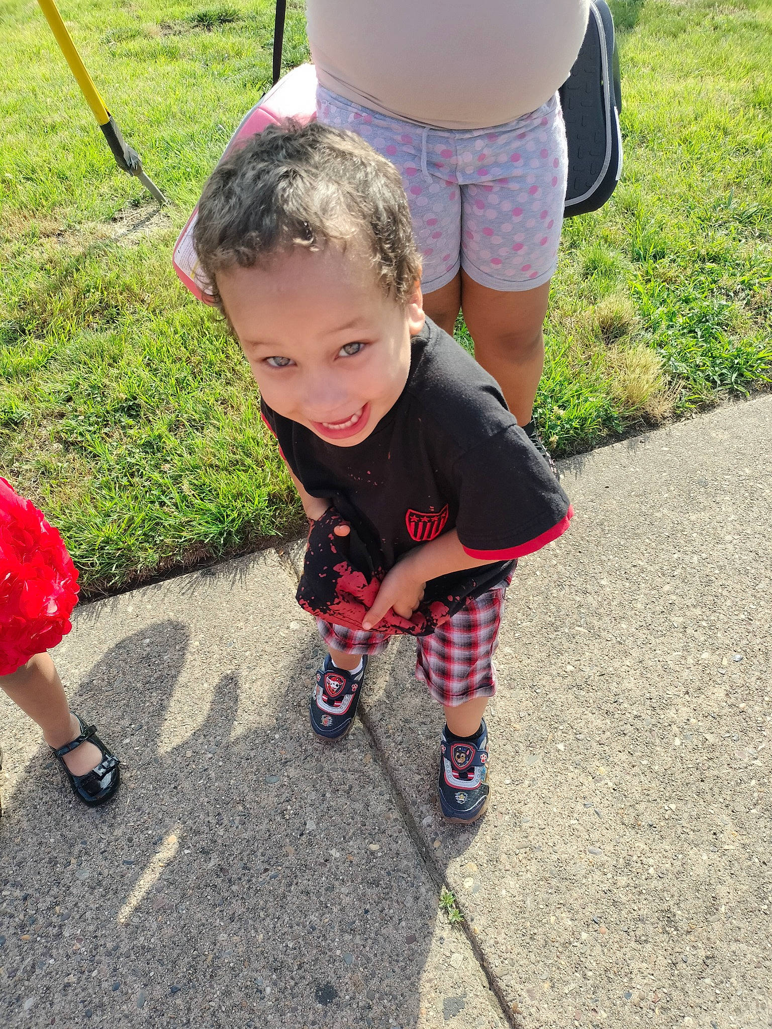 Karl-gerome joined the competition — help win amazing prizes! asphalt, flooring, fun, grass, happy, human_leg, joy, lawn, leisure, people_in_nature, person, plant, public_space, recreation, red, road_surface, sandal, shoe, shorts, sidewalk