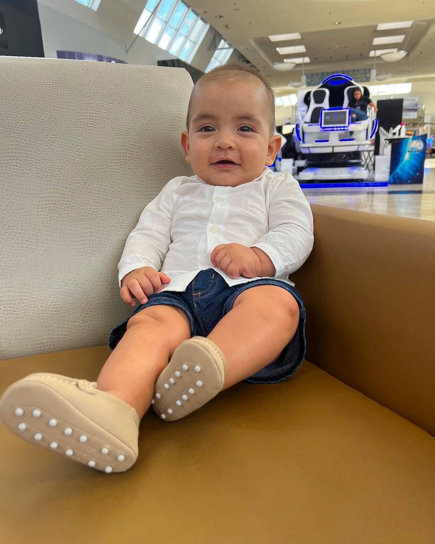 Juan joined the competition — help win amazing prizes! baby, baby_toddler_clothing, blurred, child, comfort, couch, electric_blue, finger, floor, flooring, human_leg, knee, person, room, sitting, skin, sleeve, smile, sock, t_shirt