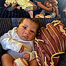 baby, child, children, baseball, baseball_glove, couch, smile, hug, sitting, clothing, indoor, family, cute, portrait, black_hair, happy, infant, playful, toddler, cozy