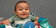Jonah Gutierrez joined the competition — help win amazing prizes! baby, smiling, walker, toy, indoor, child, happy, face, person, clothing, seat, plastic, furniture, floor, playtime, infant, cute, head, sitting, background