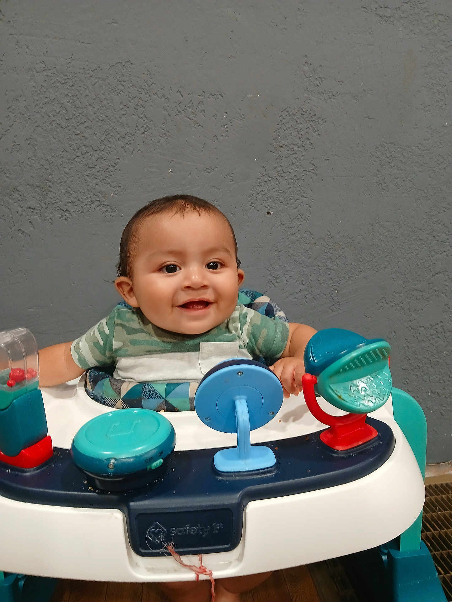Jonah Gutierrez joined the competition — help win amazing prizes! baby, smiling, walker, toy, indoor, child, happy, face, person, clothing, seat, plastic, furniture, floor, playtime, infant, cute, head, sitting, background