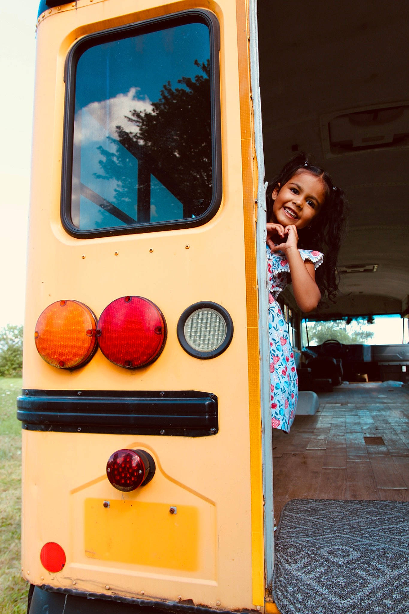 Nayeli is registered to the contest to win money with this photo: automotive_exterior, automotive_lighting, commercial_vehicle, fun, gas, joy, machine, motor_vehicle, paint, person, photograph, play, public_transport, recreation, sky, smile, t_shirt, toddler, tree, vehicle