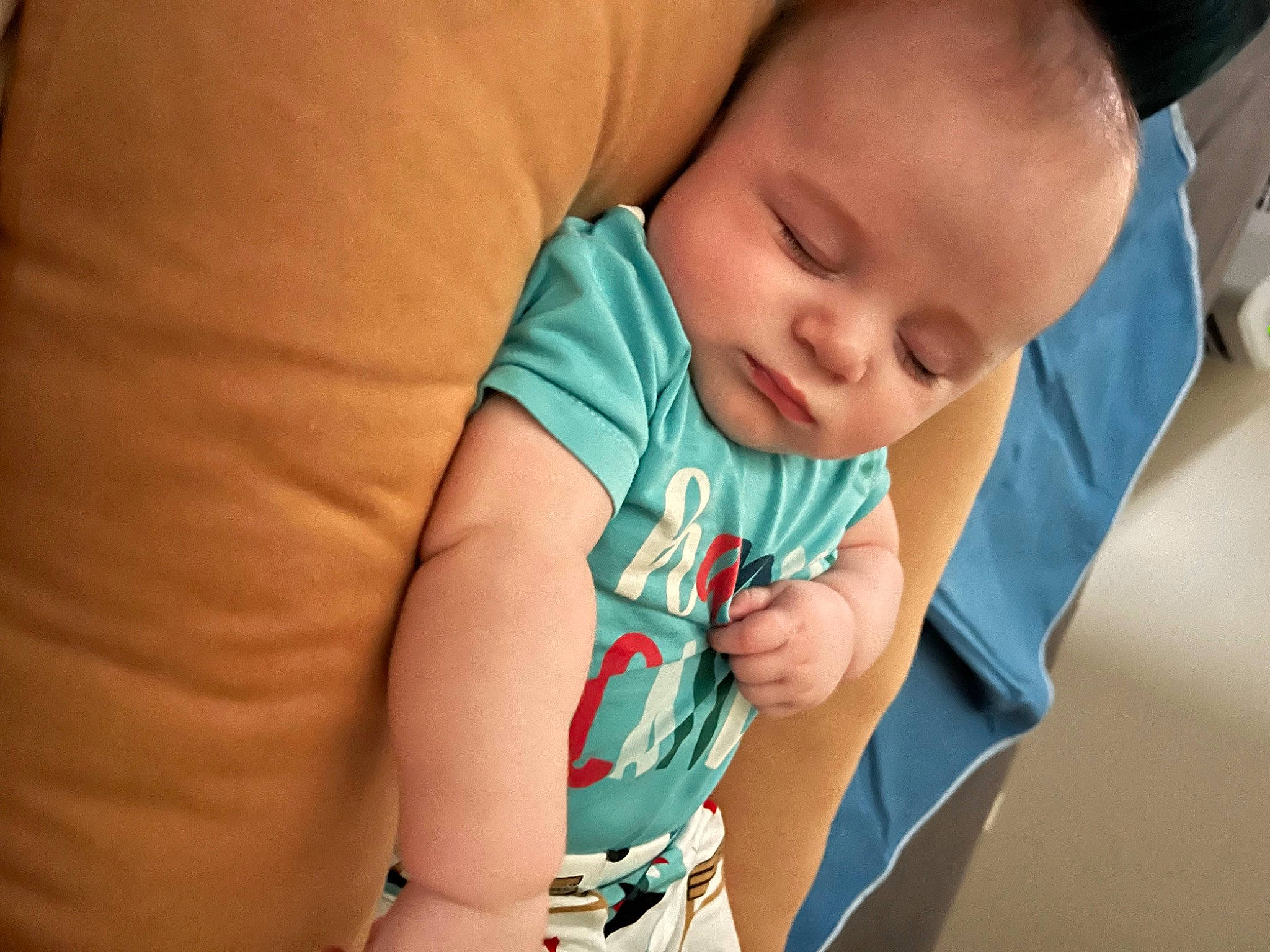 Hawkins is registered to the contest to win money with this photo: abdomen, baby, baby_products, baby_toddler_clothing, cheek, child, comfort, elbow, face, finger, grass, happy, head, iris, nose, person, sitting, skin, sleeve, t_shirt