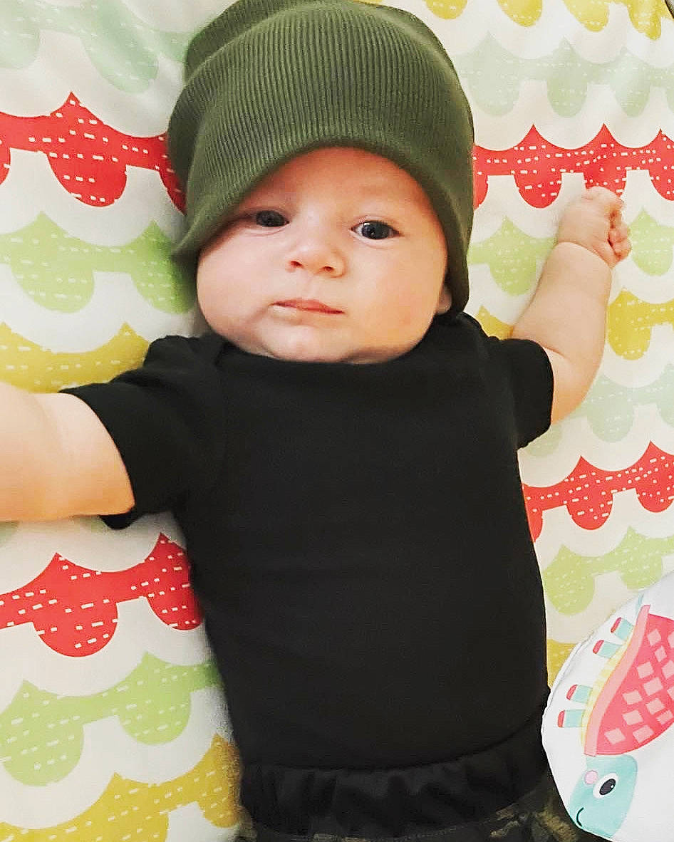 Hawkins joined the competition — help win amazing prizes! baby, baby_toddler_clothing, beanie, cap, cheek, child, fashion_accessory, happy, headgear, headwear, knit_cap, linens, outerwear, pattern, person, pink, product, room, sleeve, t_shirt
