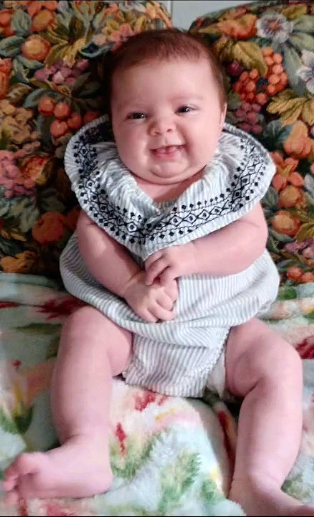 Zelda joined the competition — help win amazing prizes! baby, babylaughing, clothing, face, happy, head, person, photography, portrait, scarf, sitting, smile