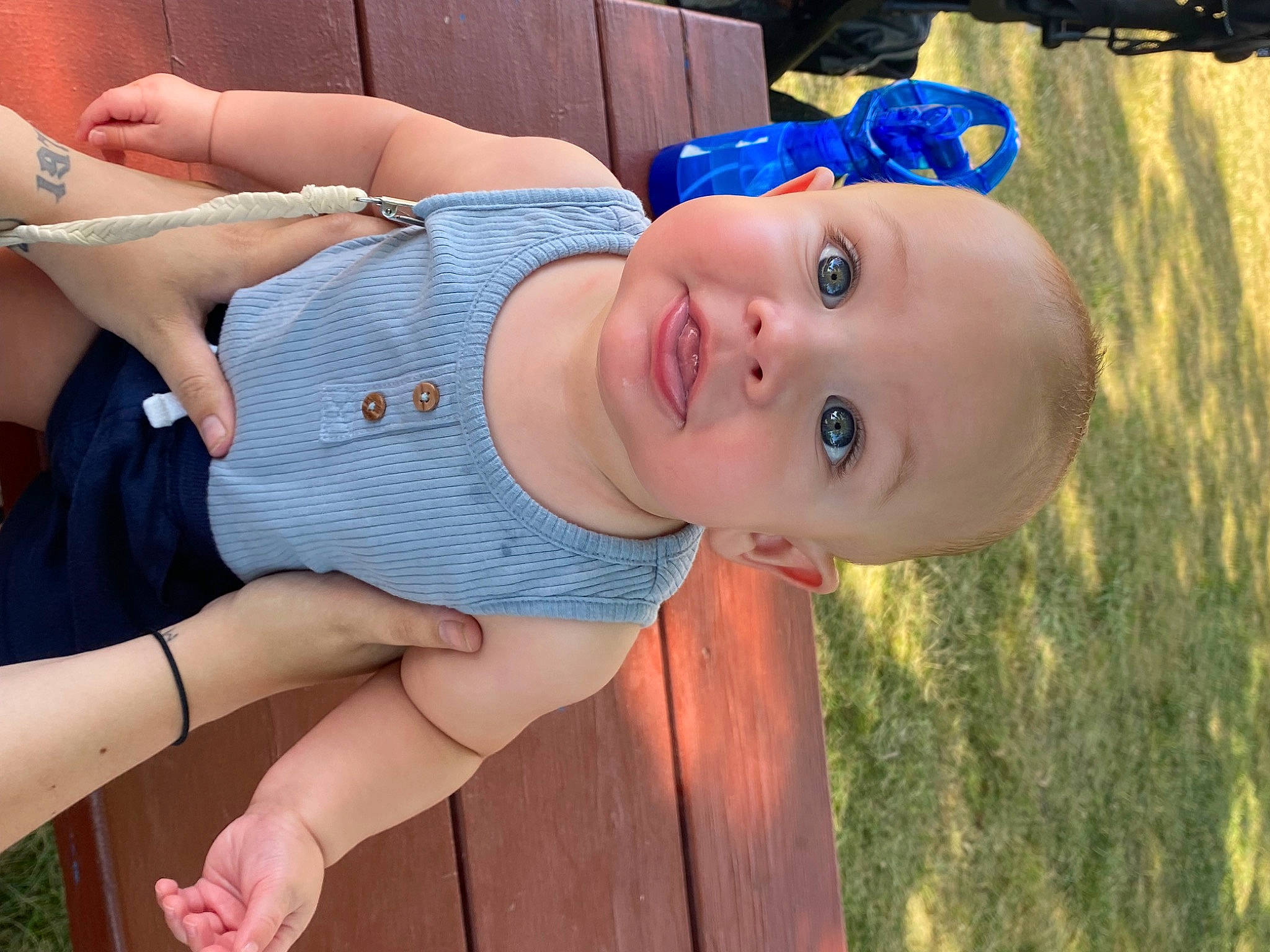 Evryn is registered to the contest to win money with this photo: baby, baby_toddler_clothing, blue, child, elbow, electric_blue, finger, fun, grass, happy, hat, human_leg, mouth, nose, person, skin, smile, sun_hat, thigh, toddler