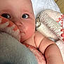 Harrison is registered to the contest to win money with this photo: baby, close_up, face, skin, blanket, soft_texture, child, indoor, cuteness, cheeks, arm, furniture, comfort, warmth, expression, curiosity, person, portrait, infant, nap_time