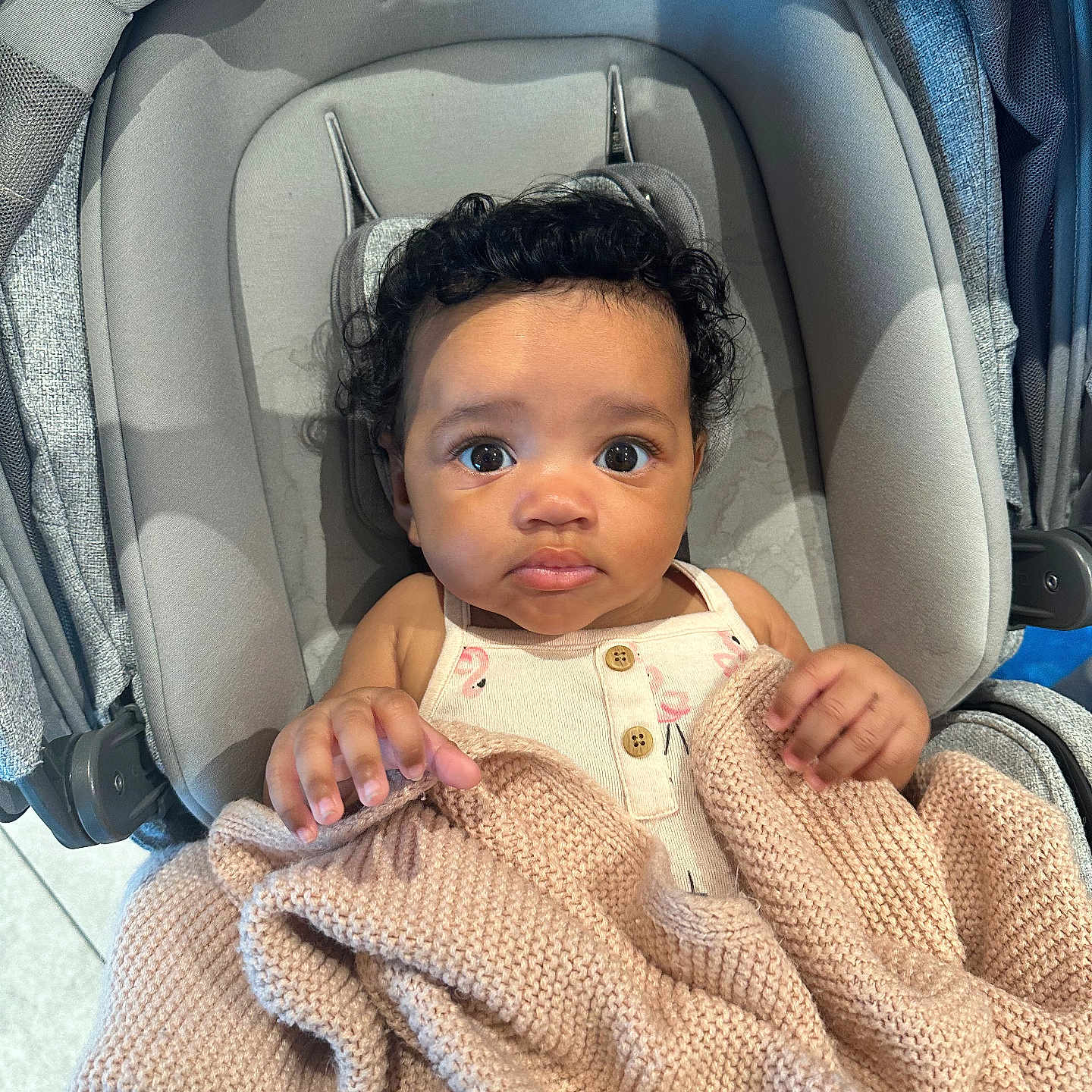 Alevyn joined the competition — help win amazing prizes! baby, infant, blanket, knitted_blanket, baby_seat, curly_hair, clothing, indoors, child, person, cute, looking_up, soft_texture, comfortable, seat, hands, expression, portrait, skin, young