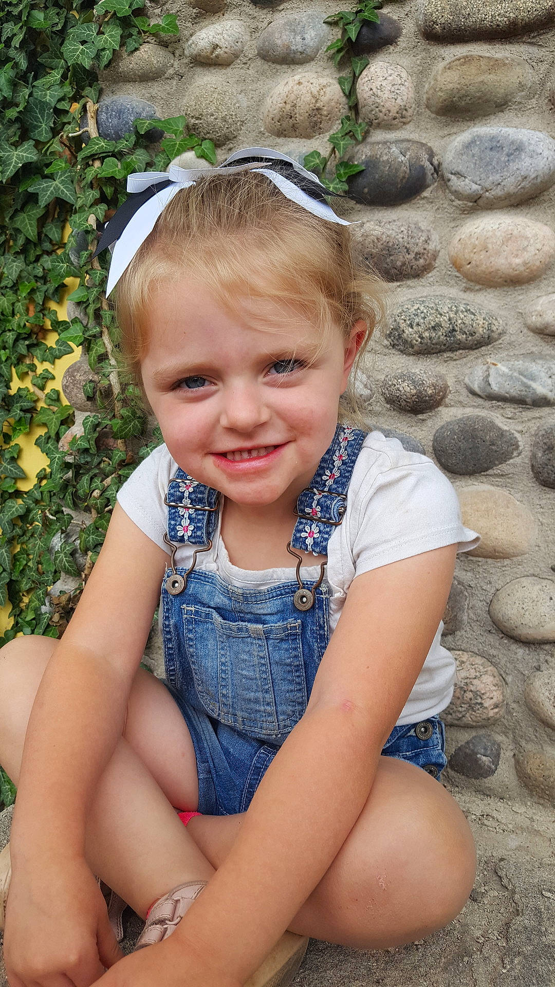 Adilyn is registered to the contest to win money with this photo: beauty, blond, child, eye, facial_expression, fun, girl, grass, hair, happiness, headgear, human_hair_color, infant, joy, leg, person, sitting, skin, smile, summer