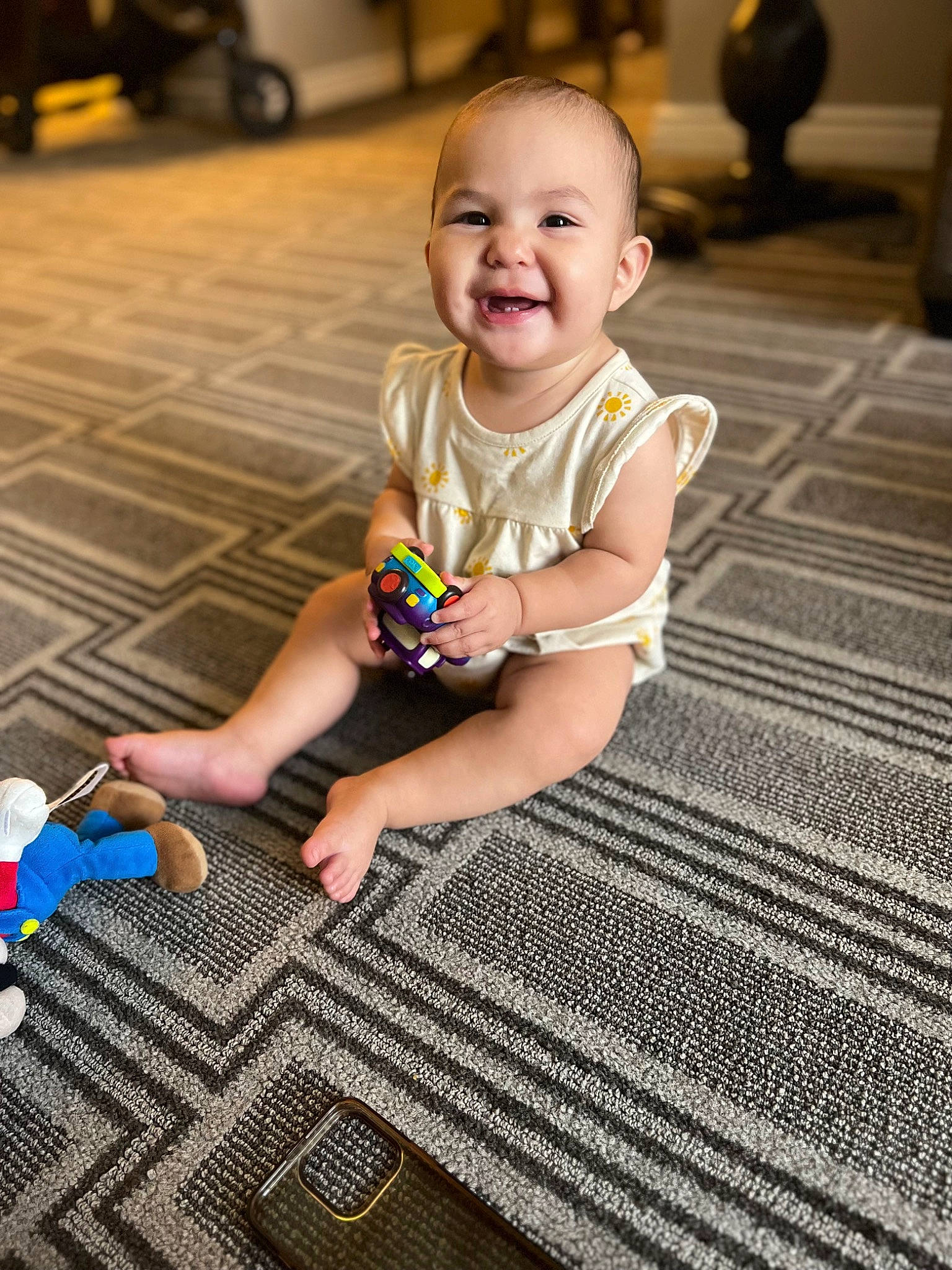 Cecilia is registered to the contest to win money with this photo: baby, baby_toddler_clothing, child, floor, flooring, foot, fun, grass, happy, hardwood, human_leg, joy, leisure, pattern, person, play, sitting, skin, smile, toddler