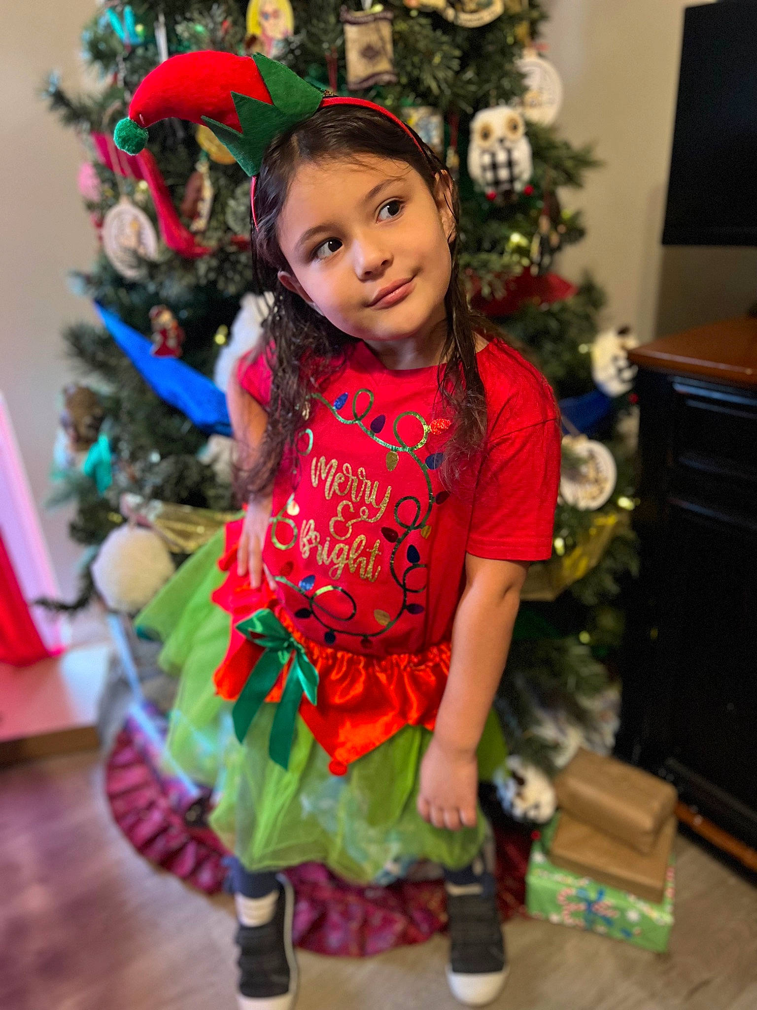 Emma joined the competition — help win amazing prizes! baby_toddler_clothing, cabinetry, child, christmas, christmas_decoration, christmas_ornament, christmas_tree, event, fun, happy, holiday, holiday_ornament, joy, magenta, ornament, person, plant, sitting, sleeve, smile