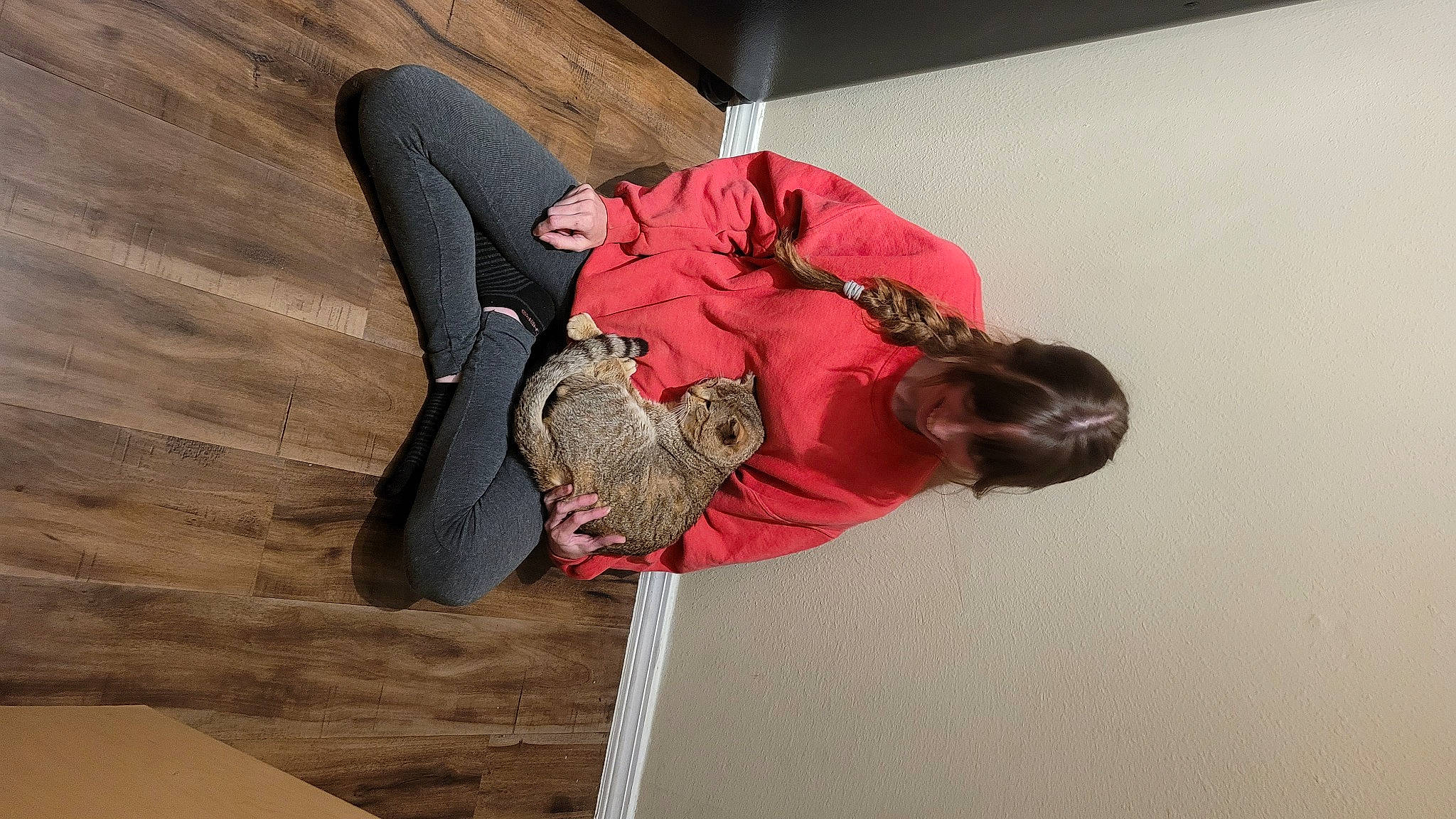 Bob is registered to the contest to win money with this photo: adventure, carmine, child, comfort, elbow, flooring, fun, fur, hardwood, headgear, knee, leisure, magenta, outdoor_shoe, recreation, walking_shoe, wood, wood_flooring