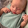 Carter is registered to the contest to win money with this photo: baby, sleeping, bib, hand, face, infant, peaceful, closeup, soft_texture, blanket, cozy, cute, child, portrait, skin, clothing, head, nap, rest, indoors