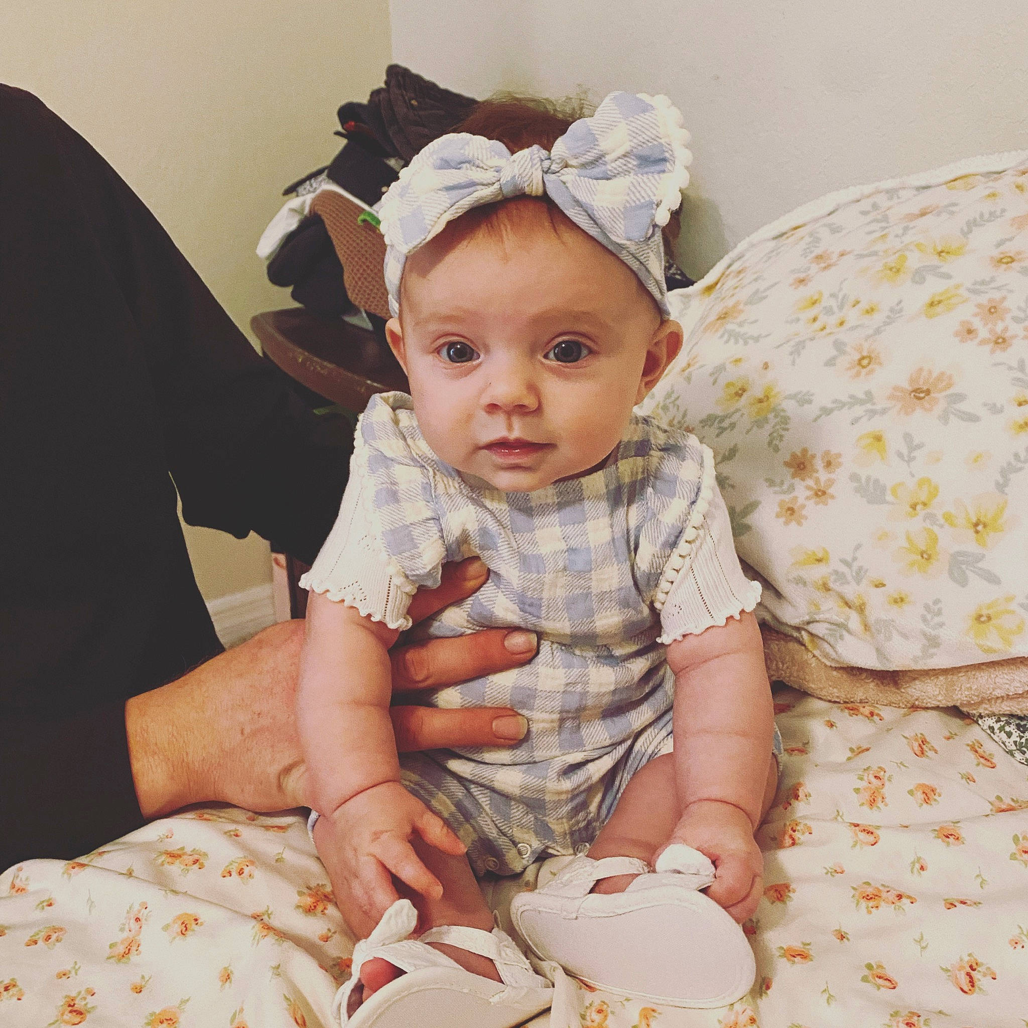 Londyn is registered to the contest to win money with this photo: baby, baby_toddler_clothing, child, comfort, costume_hat, fashion_accessory, gesture, happy, headband, headpiece, jewellery, linens, nail, pattern, peach, people, person, sitting, skin, sleeve