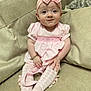 baby, bow, bracelet, child, couch, cozy, cute, fabric, feet, hands, headband, indoor, infant, patterned_clothing, pink, portrait, sitting, smile, soft_furniture, tights