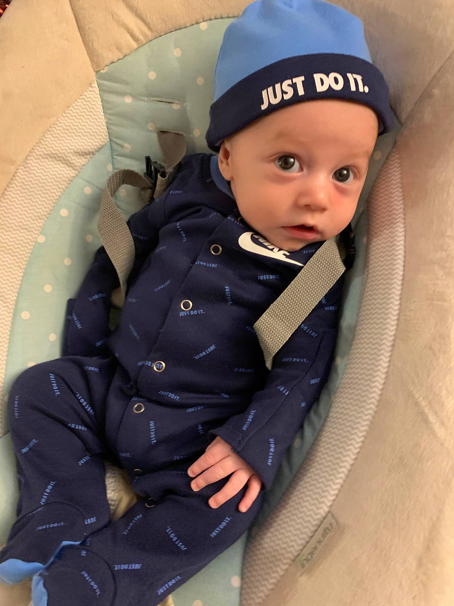 Ezrah is registered to the contest to win money with this photo: baby, baby_carriage, baby_products, cap, child, headgear, headwear, outerwear, person, product, toddler