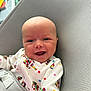 Elijah joined the competition — help win amazing prizes! baby, smiling, blue_eyes, infant, colorful_clothing, elephant_pattern, polka_dots, baby_chair, textured_fabric, close_up, happy, cute, child, seated, indoors, soft_light, playful, young, person, portrait