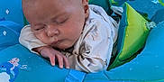 Elijah joined the competition — help win amazing prizes! baby, infant, sleeping, pool, water, float, inflatable, blue, child, relaxation, summer, cute, peaceful, water_droplets, swimming, leisure, outdoor, floating, sleeve, small_hands