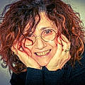 Carmela B.