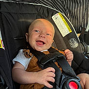 Banx joined the competition — help win amazing prizes! baby, black, brown, car_seat, child, closeup, clothing, cute, drool, happy, harness, infant, infant_clothing, person, portrait, safety, seatbelt, smile, stripes, white