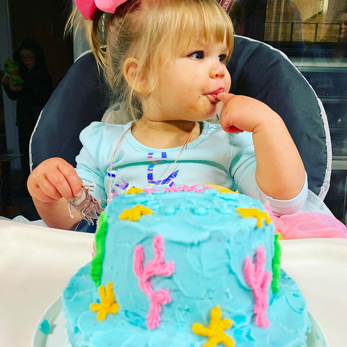 Emilia is registered to the contest to win money with this photo: baby_toddler_clothing, baked_goods, baking, birthday_cake, buttercream, cake, cake_decorating, cake_decorating_supply, child, cuisine, dessert, food, hair_accessory, icing, ingredient, party, person, pink, sugar_cake, sweetness