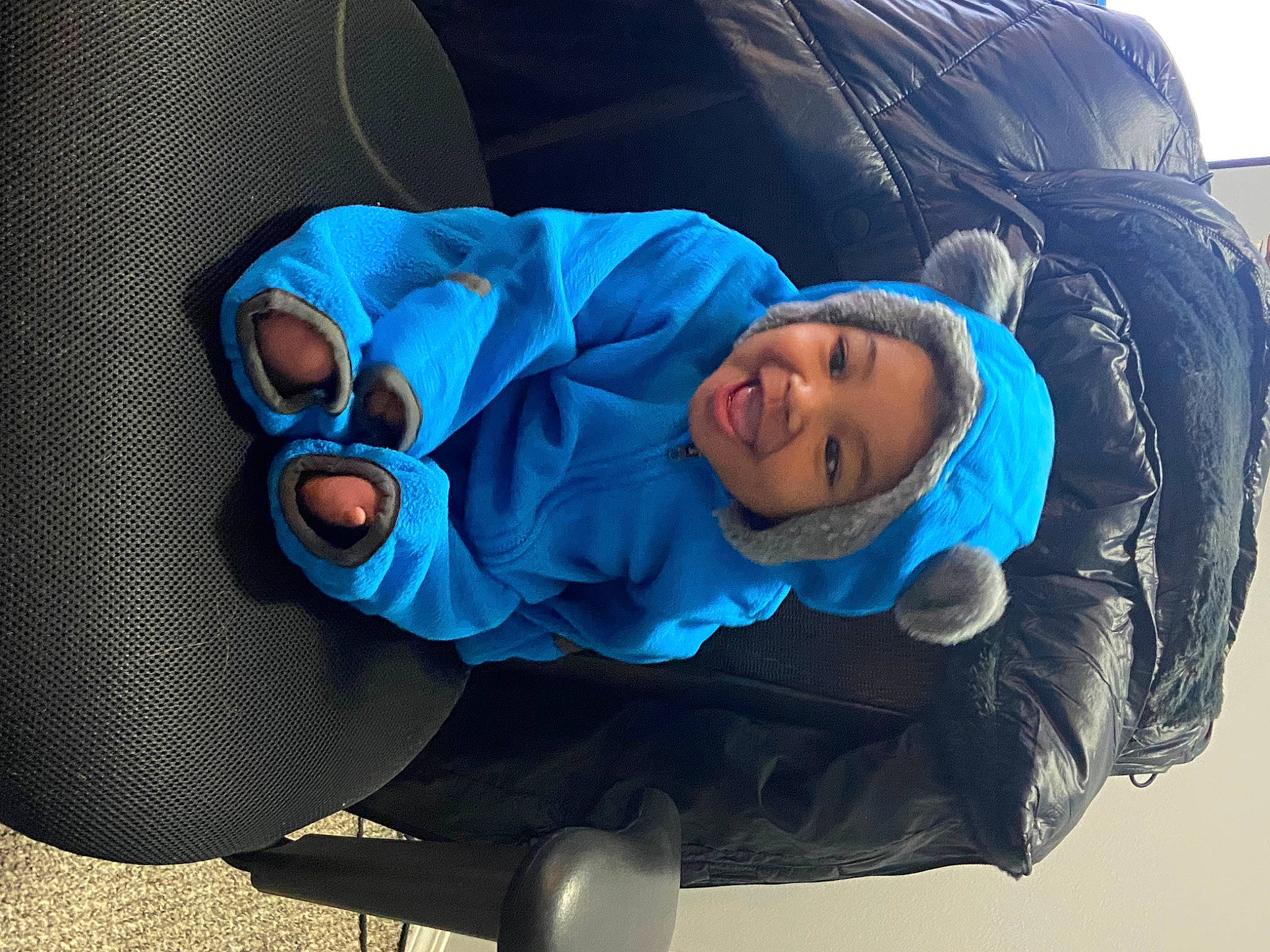Elijah is registered to the contest to win money with this photo: auto_part, automotive_tire, automotive_wheel_system, baby, baby_products, baby_toddler_clothing, blue, child, comfort, electric_blue, fun, hat, headwear, jacket, leisure, outerwear, person, personal_protective_equipment, recreation, sitting