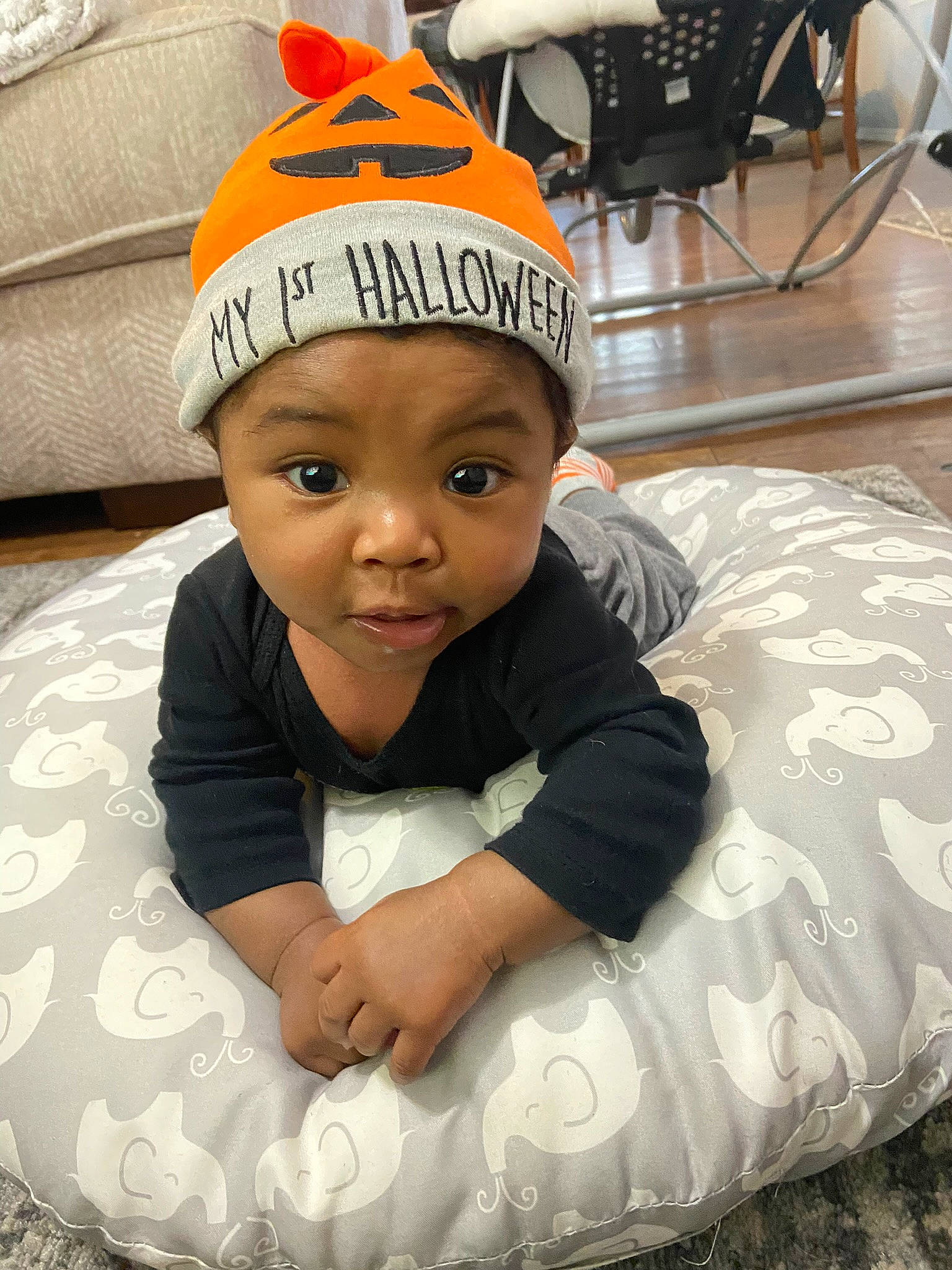 Elijah joined the competition — help win amazing prizes! baby, baby_products, baby_toddler_clothing, baseball_cap, beanie, cap, child, comfort, eye, finger, flooring, fun, happy, head, headwear, human_body, knit_cap, linens, person, sitting