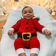 Soldier joined the competition — help win amazing prizes! baby, infant, christmas_tree, holiday, festive_clothing, santa_outfit, red_clothing, white_blanket, ornaments, smile, happy, indoor, decorations, celebration, cute, child, feet, hands, portrait, seasonal