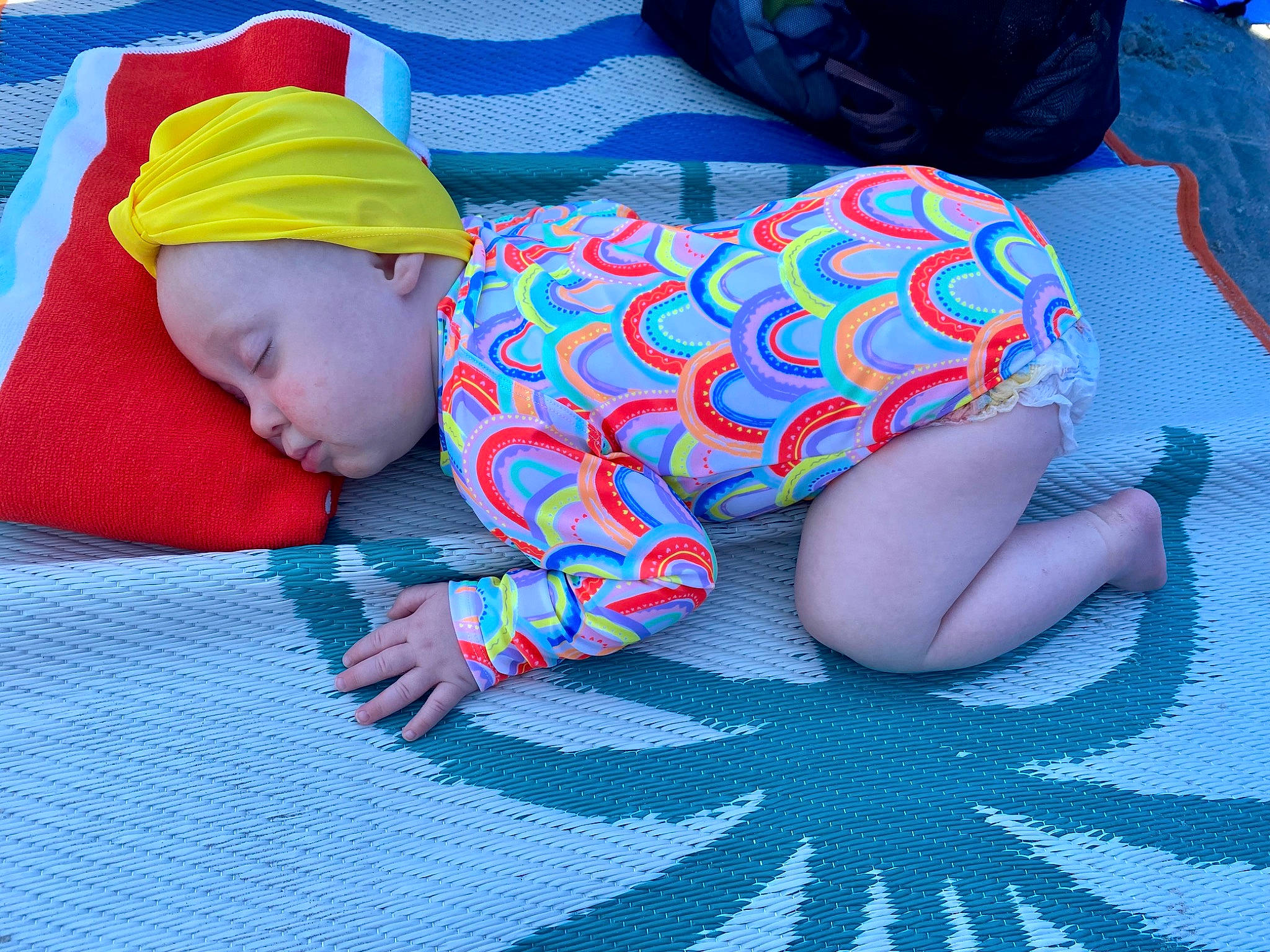 Emberlyn is registered to the contest to win money with this photo: azure, baby, baby_products, baby_sleeping, baby_toddler_clothing, blue, carmine, child, comfort, electric_blue, flooring, human_leg, linens, nap, pattern, person, room, sitting, sleeve, textile