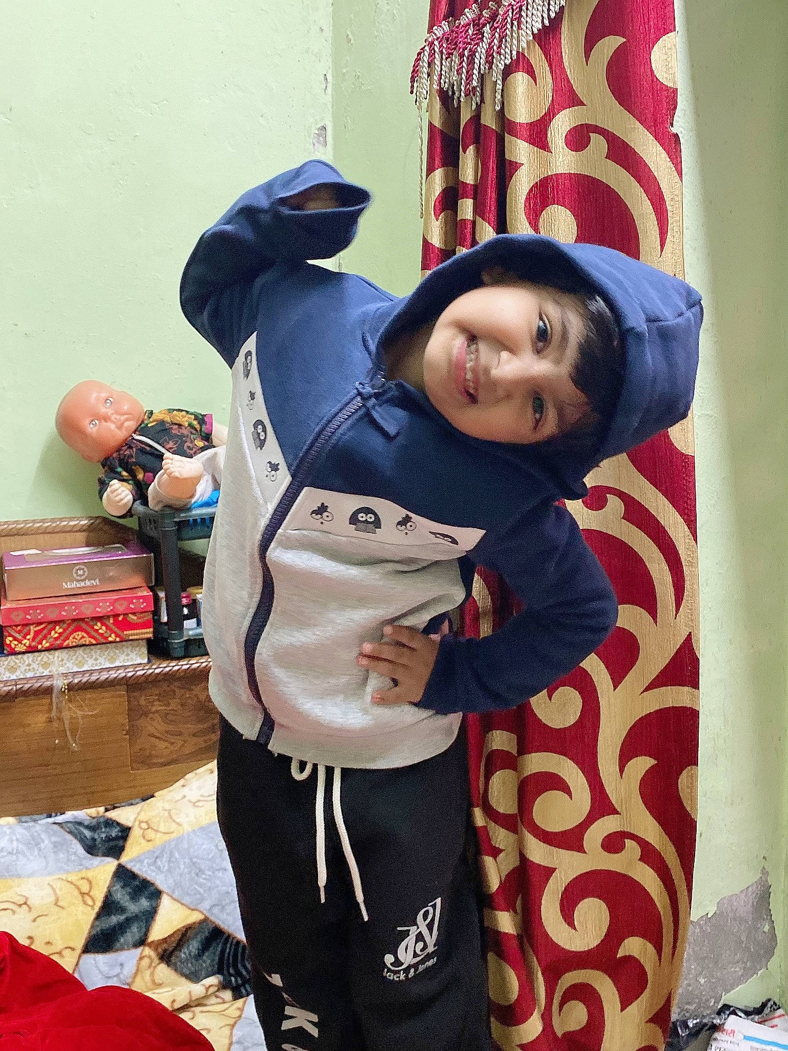Seerat is registered to the contest to win money with this photo: bag, box, child, costume, event, fun, glove, happy, headwear, joy, leisure, linens, luggage_and_bags, person, pink, recreation, room, sleeve, smile, sportswear