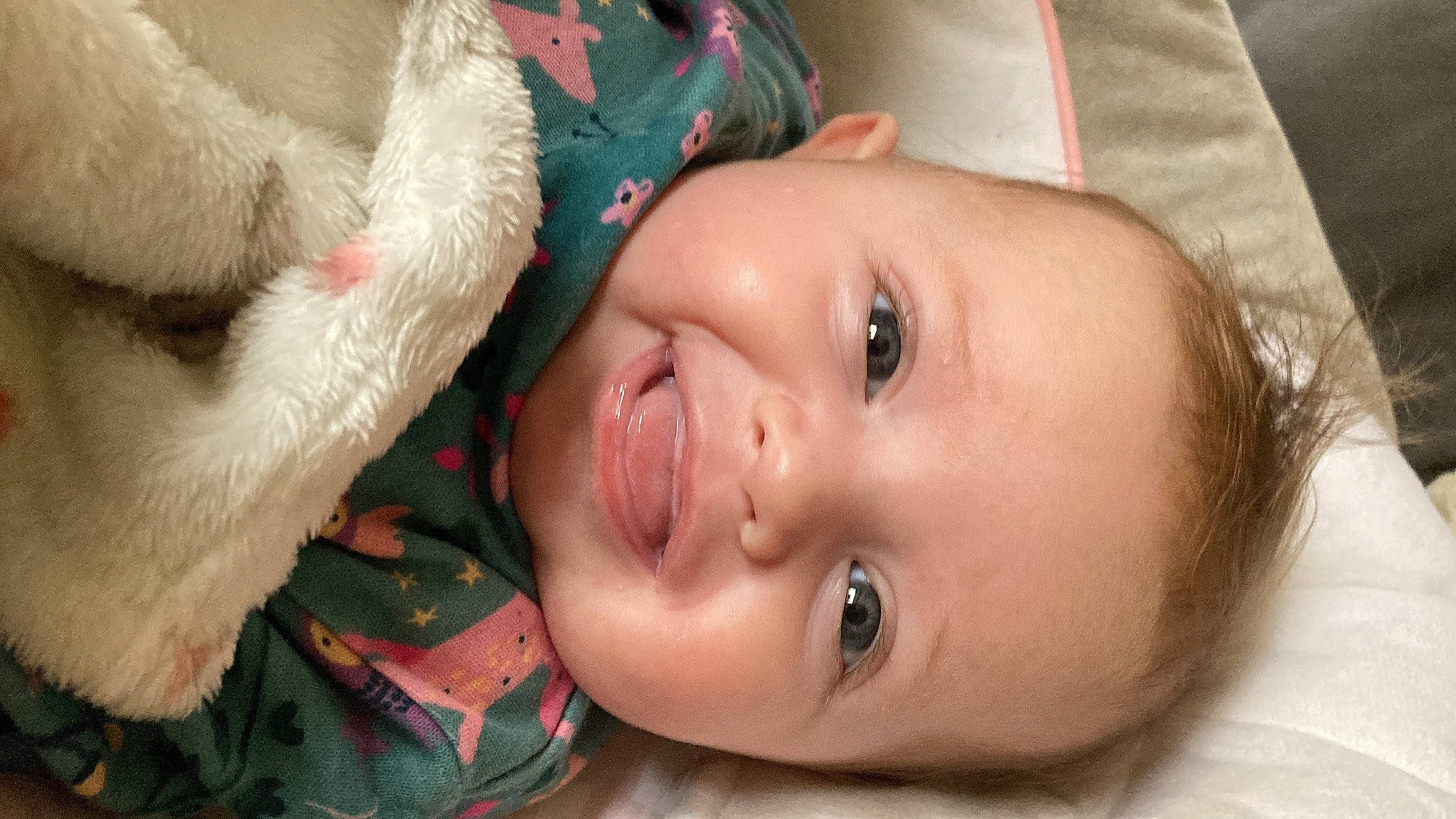 Blossom is registered to the contest to win money with this photo: baby, baby_toddler_clothing, cheek, child, ear, eyebrow, eyelash, face, happy, human_body, iris, lip, mammal, mouth, nose, person, plant, skin, smile, toddler