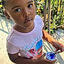 Maria is registered to the contest to win money with this photo: child, clothing, cream, cutlery, dessert, face, female, food, footwear, frozenyogurt, girl, head, icecream, jar, person, photography, portrait, shoe, spoon, t_shirt