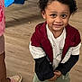 Rory is registered to the contest to win money with this photo: child, clothing, coat, face, female, footwear, girl, hair, happy, head, jacket, pants, person, photography, portrait, shoe, shorts, smile, sneaker, wood